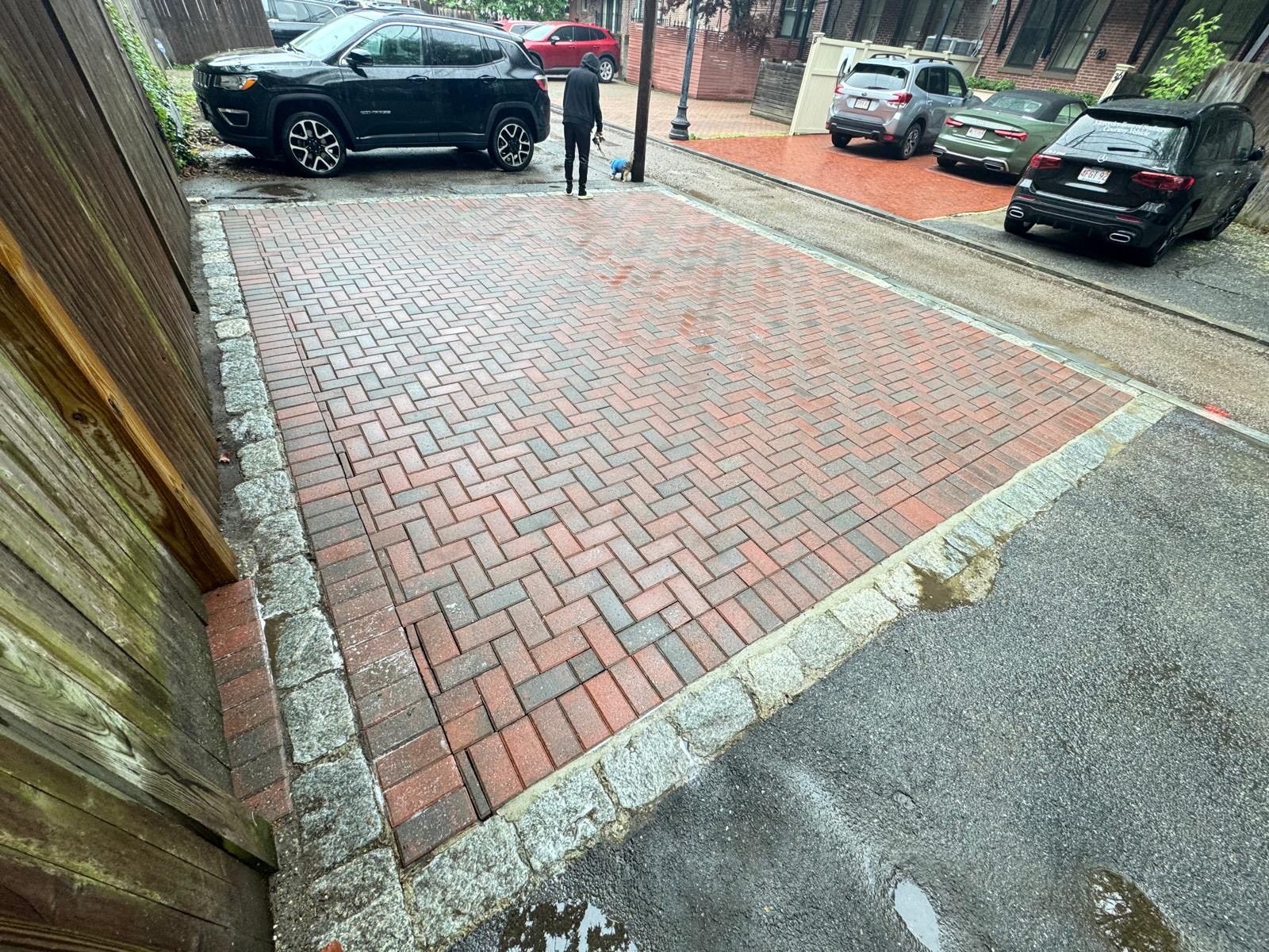 Herringbone brick paving with granite cobble edging